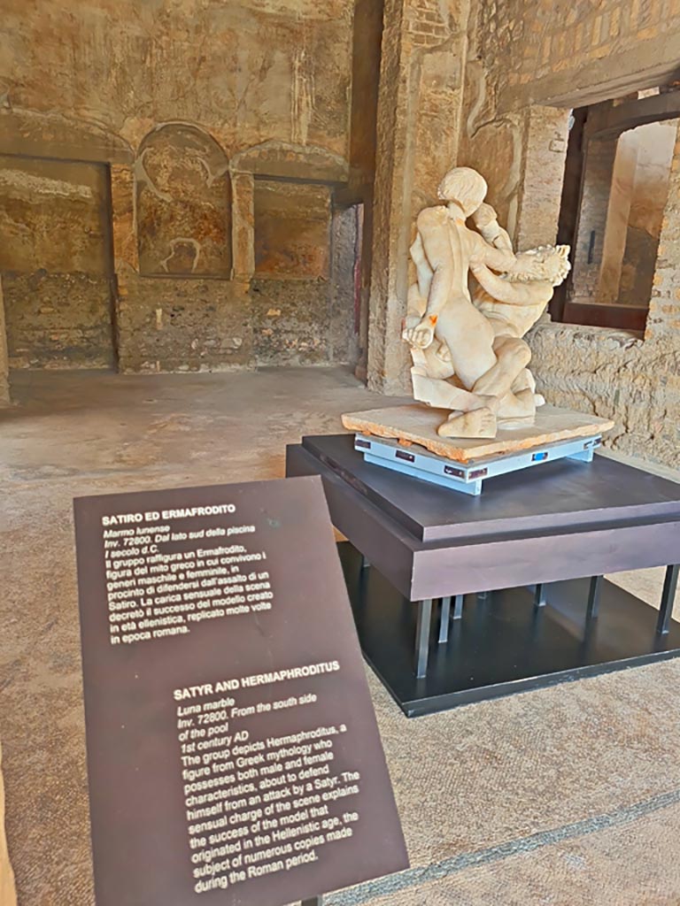 Oplontis Villa of Poppea, October 2023. 
Room 74, looking north-west towards window into garden room 87, on right, and information card for statue.
Photo courtesy of Giuseppe Ciaramella.
