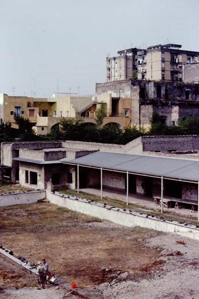 Oplontis, c.1978.Looking south-west across pool towards area 60, the portico.
On the left are the two windows of room 78. Photo by Stanley A. Jashemski. 
Source: The Wilhelmina and Stanley A. Jashemski archive in the University of Maryland Library, Special Collections (See collection page) and made available under the Creative Commons Attribution-Non Commercial License v.4. See Licence and use details. Oplo0158