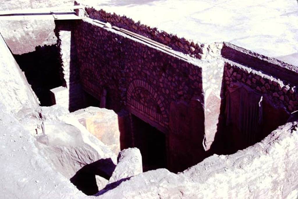 Oplontis, 1977. Room 88, on left, looking towards south side during reconsolidation. 
Room 87, at the rear of room 88, can be seen in the centre and on the right.
Photo by Stanley A. Jashemski.   
Source: The Wilhelmina and Stanley A. Jashemski archive in the University of Maryland Library, Special Collections (See collection page) and made available under the Creative Commons Attribution-Non Commercial License v.4. See Licence and use details. J77f0396