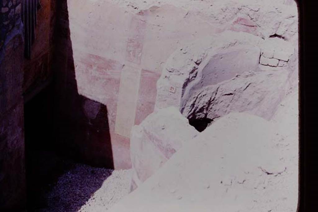 Oplontis, 1977. Room 89, with semi-circular window on right and room 87 on left. 
Photo by Stanley A. Jashemski.   
Source: The Wilhelmina and Stanley A. Jashemski archive in the University of Maryland Library, Special Collections (See collection page) and made available under the Creative Commons Attribution-Non Commercial License v.4. See Licence and use details.
J77f0554