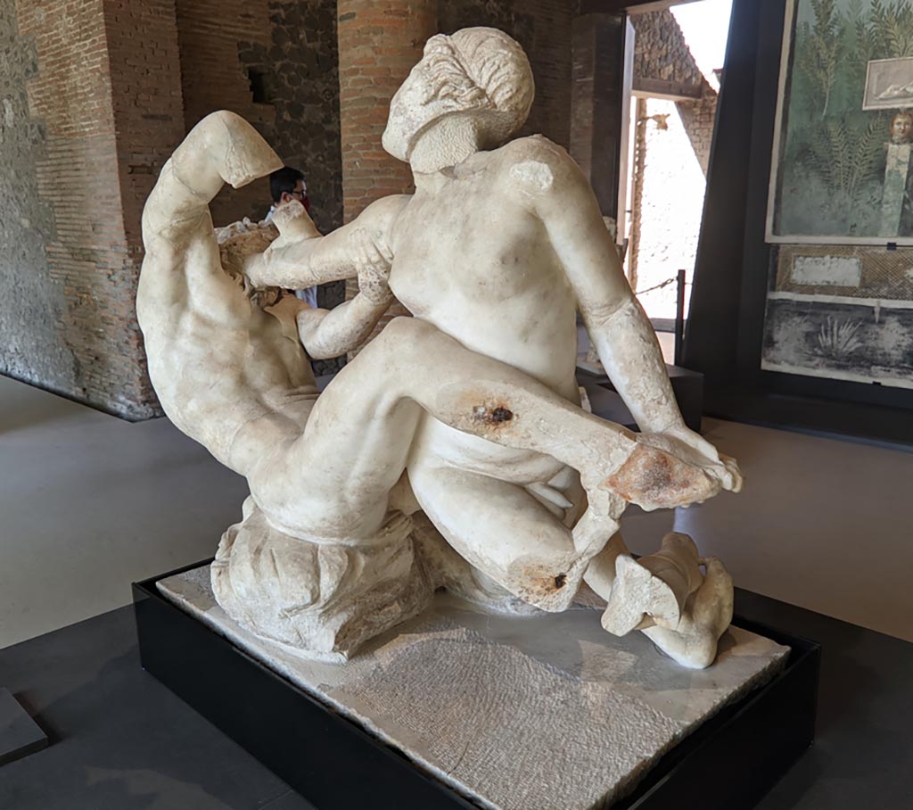 Oplontis Villa of Poppea, April 2022. 
Marble statuette of hermaphrodite and a satyr, on display at II.7.9, the Palaestra in Pompeii. Photo courtesy of Giuseppe Ciaramella.
According to the information card – This was a 1st century AD (Roman copy of an Hellenistic original). 
I sec. d.C (copia romana di originale di eta tardo ellenistica.)