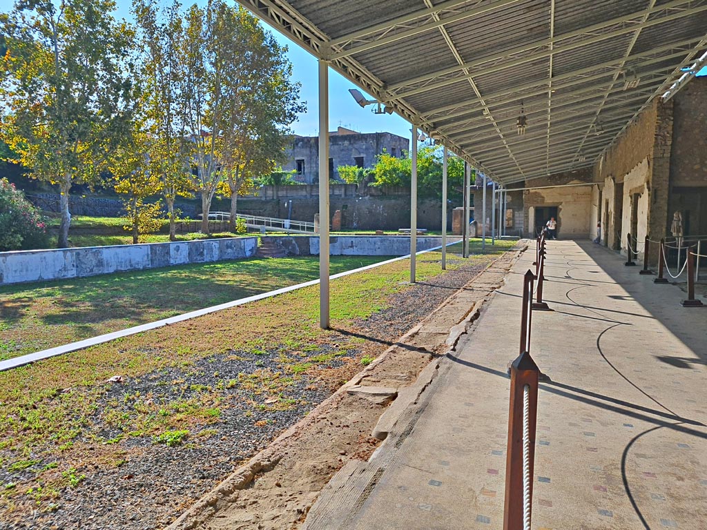 Oplontis Villa of Poppea, October 2023. 
Area 96, looking south-east across swimming pool from area 80, the east side of the west portico. Photo courtesy of Giuseppe Ciaramella.