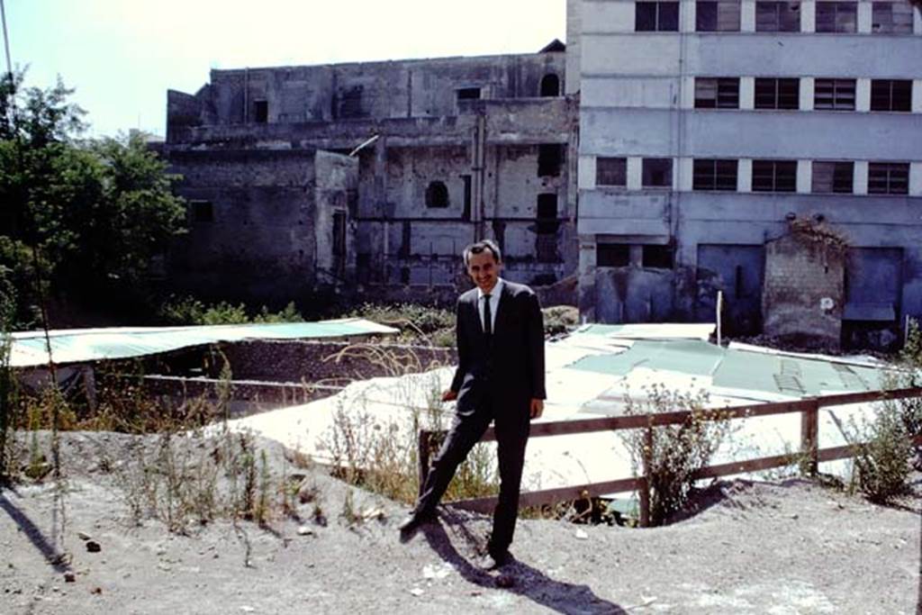Oplontis, 1968.  Dr. Carlo Giordano posing for a photo above the largely still-to-be excavated villa, looking south. Photo by Stanley A. Jashemski.
Source: The Wilhelmina and Stanley A. Jashemski archive in the University of Maryland Library, Special Collections (See collection page) and made available under the Creative Commons Attribution-Non Commercial License v.4. See Licence and use details. J68f1504