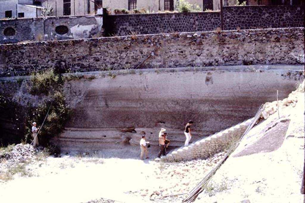 Oplontis, 1973. Wilhelmina being carried up the exit stairs, due to her bad ankle. 
Photo by Stanley A. Jashemski. 
Source: The Wilhelmina and Stanley A. Jashemski archive in the University of Maryland Library, Special Collections (See collection page) and made available under the Creative Commons Attribution-Non Commercial License v.4. See Licence and use details. J73f0384