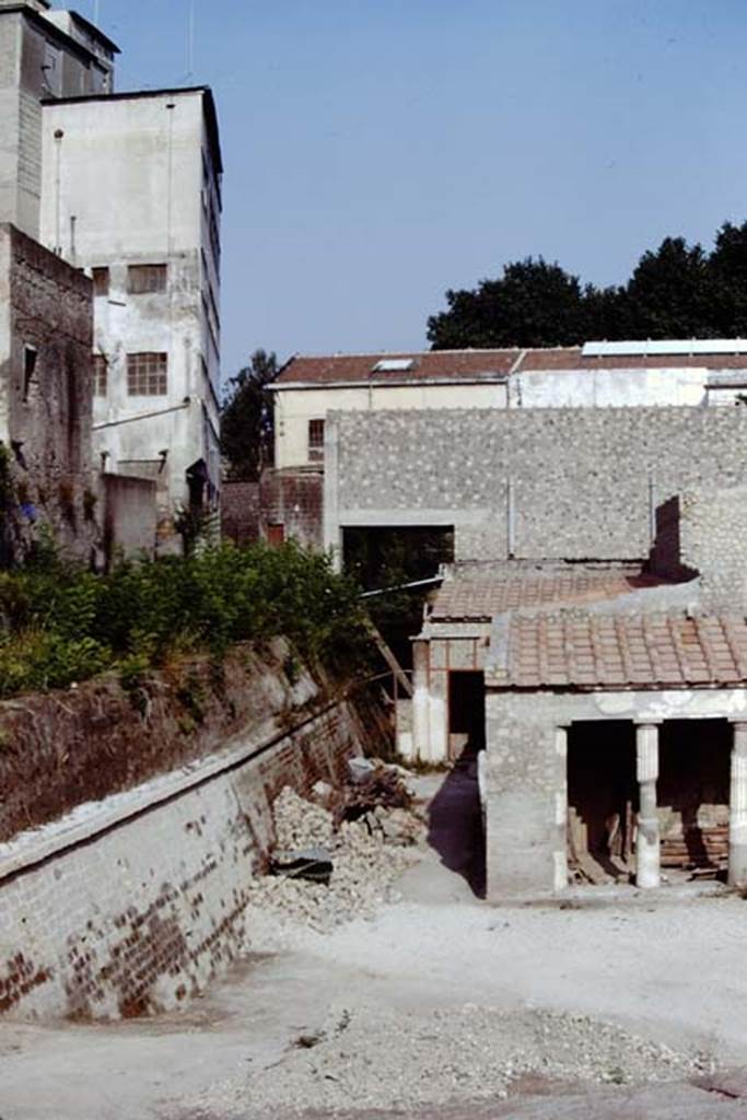 Oplontis Villa of Poppea, 1975 or 1974. Area 59/24, looking west along south side of villa, towards room 23.  Photo by Stanley A. Jashemski.   
Source: The Wilhelmina and Stanley A. Jashemski archive in the University of Maryland Library, Special Collections (See collection page) and made available under the Creative Commons Attribution-Non Commercial License v.4. See Licence and use details. J74f0868