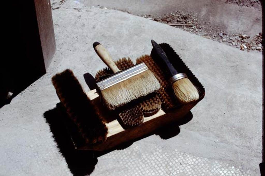 Oplontis Villa of Poppea, 1975 or 1974. Work-tools of the restorers.  Photo by Stanley A. Jashemski.   
Source: The Wilhelmina and Stanley A. Jashemski archive in the University of Maryland Library, Special Collections (See collection page) and made available under the Creative Commons Attribution-Non Commercial License v.4. See Licence and use details. J74f0877
