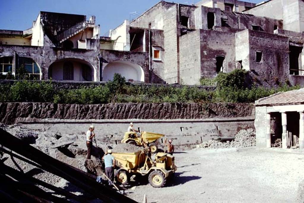 Oplontis Villa of Poppea, 1975 or 1974. Further clearing of lapilli in area 59, the south-east peristyle. Looking south-west. Photo by Stanley A. Jashemski.   
Source: The Wilhelmina and Stanley A. Jashemski archive in the University of Maryland Library, Special Collections (See collection page) and made available under the Creative Commons Attribution-Non Commercial License v.4. See Licence and use details. J74f0895