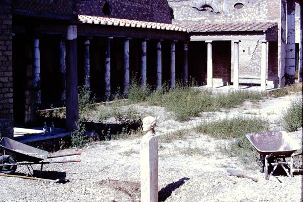 Oplontis, 1975. Looking south-west across north garden, near east portico 34, where the head and shaft were discovered. Photo by Stanley A. Jashemski.   
Source: The Wilhelmina and Stanley A. Jashemski archive in the University of Maryland Library, Special Collections (See collection page) and made available under the Creative Commons Attribution-Non Commercial License v.4. See Licence and use details. J74f0909