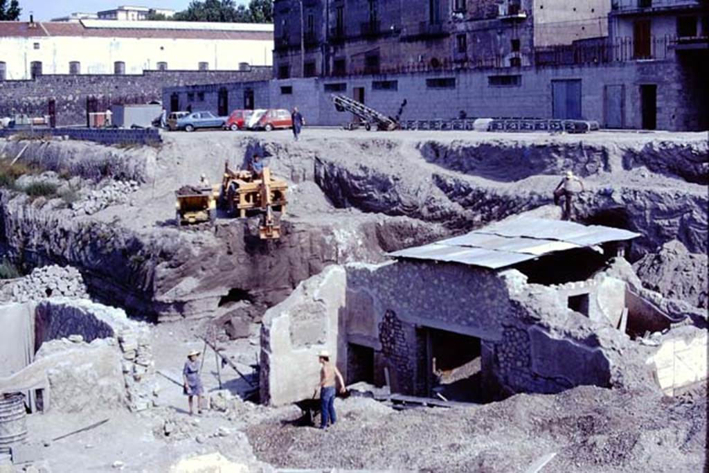 Oplontis, 1975. Looking north-west from room 69, through gap in wall towards north garden, and area still being dug-out. On the right (north) is the small doorway to room 71, and a large doorway into room 70.  Photo by Stanley A. Jashemski.   
Source: The Wilhelmina and Stanley A. Jashemski archive in the University of Maryland Library, Special Collections (See collection page) and made available under the Creative Commons Attribution-Non Commercial License v.4. See Licence and use details. J75f0019