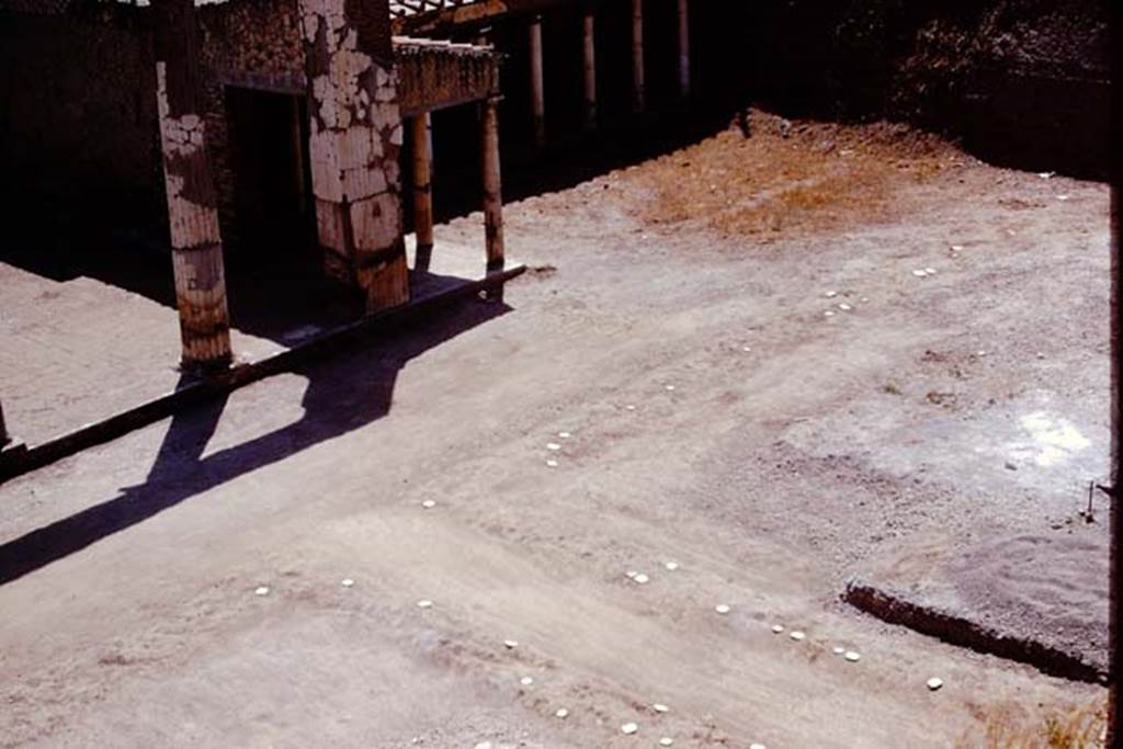 Oplontis, 1975. Looking south-west towards room 21, and the pathway leading westwards along the west portico. Photo by Stanley A. Jashemski.   
Source: The Wilhelmina and Stanley A. Jashemski archive in the University of Maryland Library, Special Collections (See collection page) and made available under the Creative Commons Attribution-Non Commercial License v.4. See Licence and use details. J75f0522