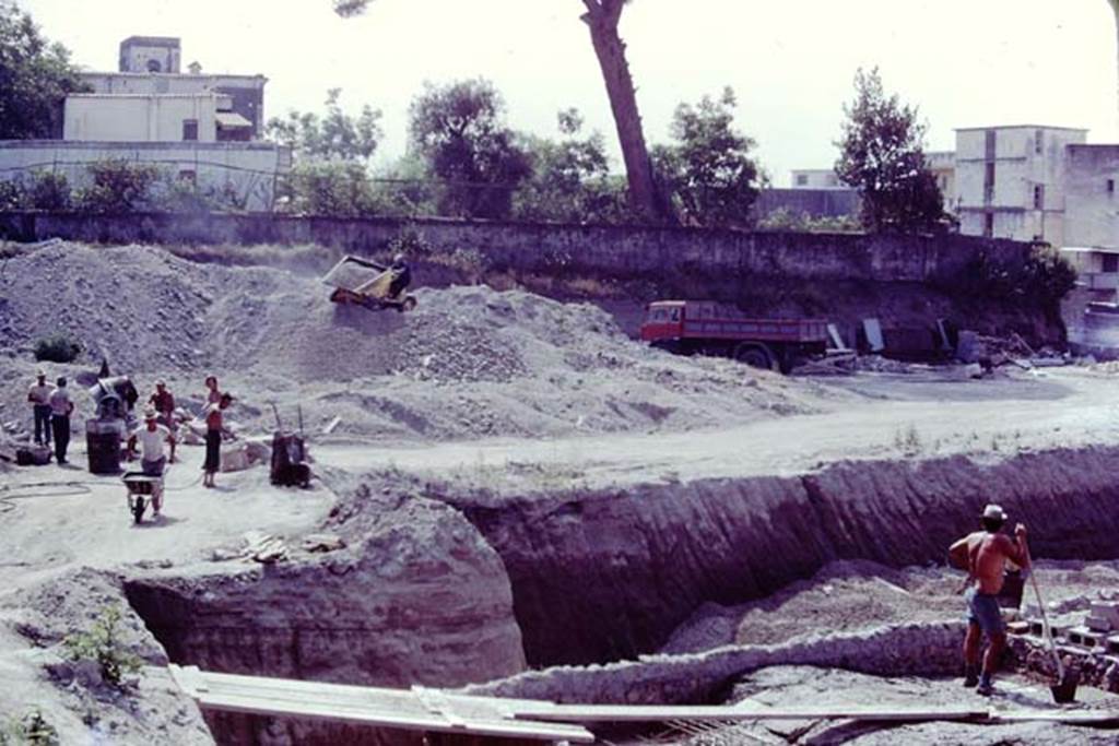 Oplontis, 1977. Looking east from above room 74, towards the still unexcavated area, above the pool. Photo by Stanley A. Jashemski.   
Source: The Wilhelmina and Stanley A. Jashemski archive in the University of Maryland Library, Special Collections (See collection page) and made available under the Creative Commons Attribution-Non Commercial License v.4. See Licence and use details. J77f0148