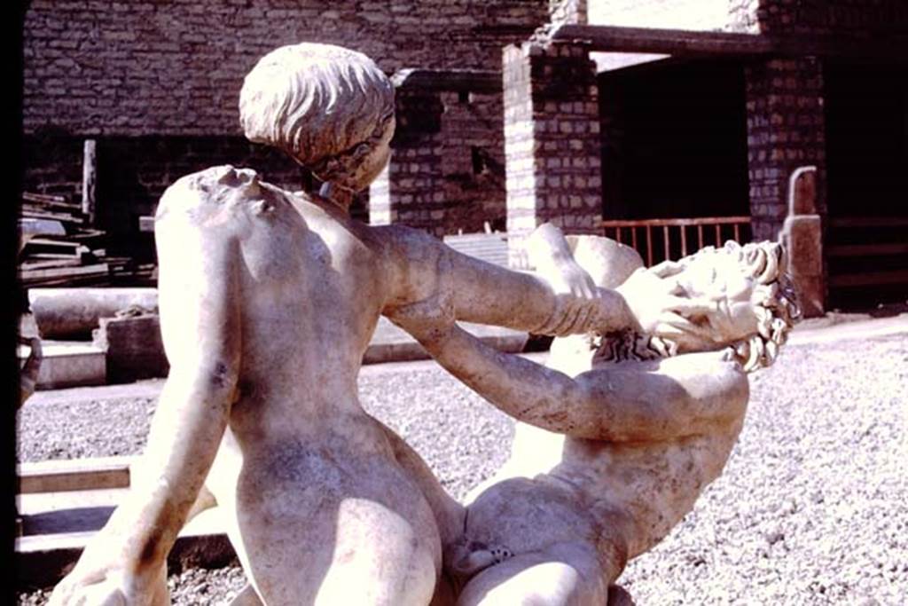 Oplontis Villa of Poppea, 1978. Detail from marble statue of hermaphrodite and faun. 
Photo by Stanley A. Jashemski.   
Source: The Wilhelmina and Stanley A. Jashemski archive in the University of Maryland Library, Special Collections (See collection page) and made available under the Creative Commons Attribution-Non Commercial License v.4. See Licence and use details.
J78f0053
SAP inventory number 72800.