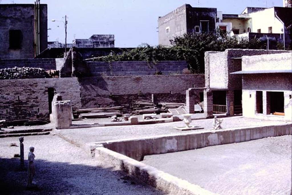 Oplontis, 1978. Area 92, looking south at east end of the pool. 
A herm of Hercules and the statue of an ephebos are standing on their original bases. 
Photo by Stanley A. Jashemski.   
Source: The Wilhelmina and Stanley A. Jashemski archive in the University of Maryland Library, Special Collections (See collection page) and made available under the Creative Commons Attribution-Non Commercial License v.4. See Licence and use details.
J78f0057