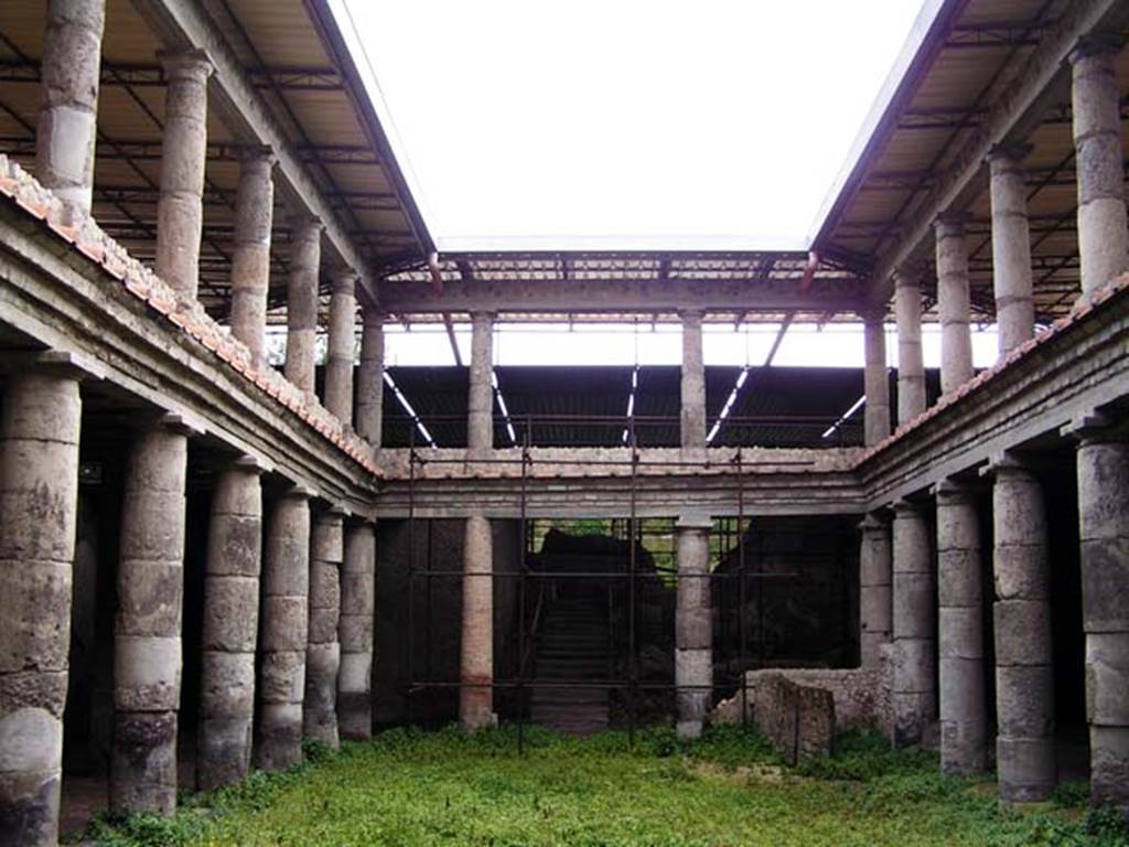 Oplontis, Villa L. Crassius Tertius. March 2005. Central courtyard 27 and two tier peristyle, looking east. 
Photo courtesy of Massimo Gravili.