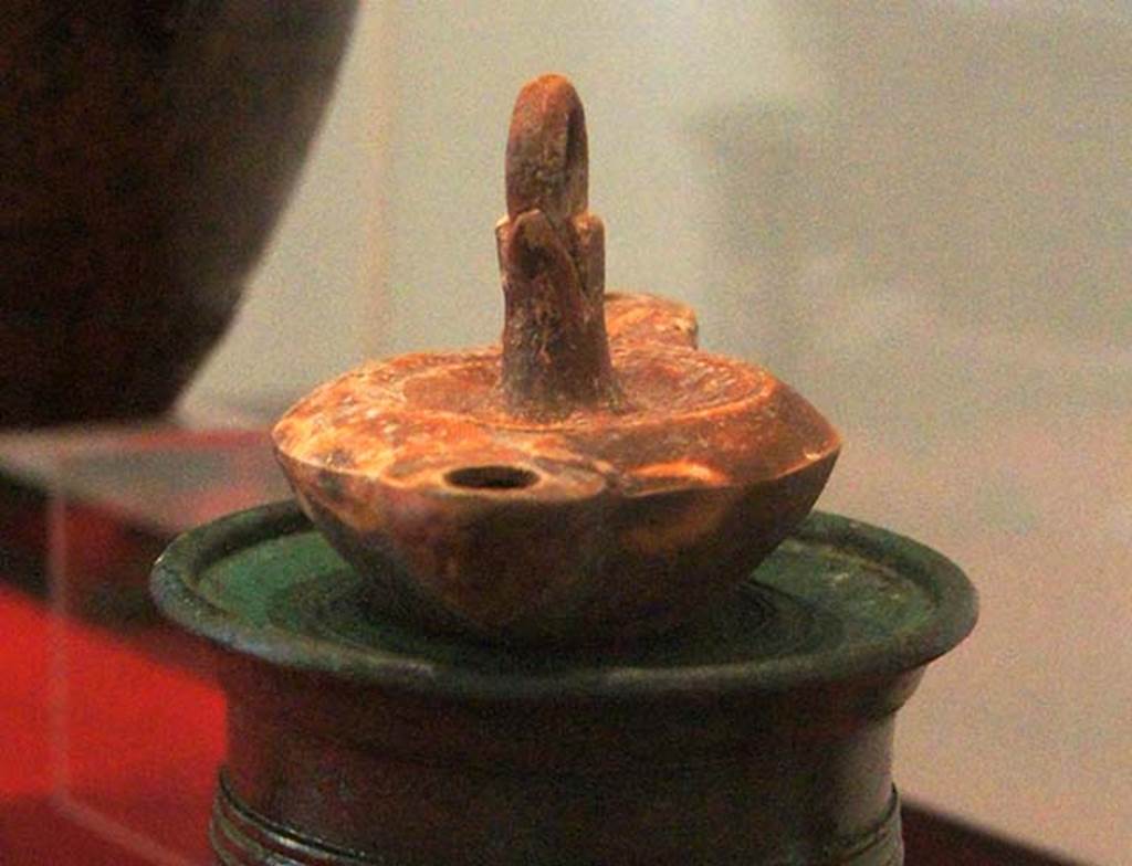 Gragnano, Villa rustica in Località Carmiano, Villa A. Lamp found in room 6.
Stabiae Antiquarium, inventory number 63543. 
The lamp stand was found in room 2.
Photo courtesy of Margaret Hicks.