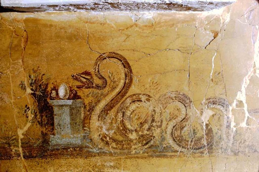 Gragnano, Villa rustica in Località Carmiano, Villa A. 1968. 
From dividing pilaster between kitchen room 4 and room 2. 
Underneath the aedicula lararium, a painted serpent was found, moving to the right towards an altar on which was deposited the offerings. 
Photo by Stanley A. Jashemski.
Source: The Wilhelmina and Stanley A. Jashemski archive in the University of Maryland Library, Special Collections (See collection page) and made available under the Creative Commons Attribution-Non Commercial License v.4. See Licence and use details.
J68f1876