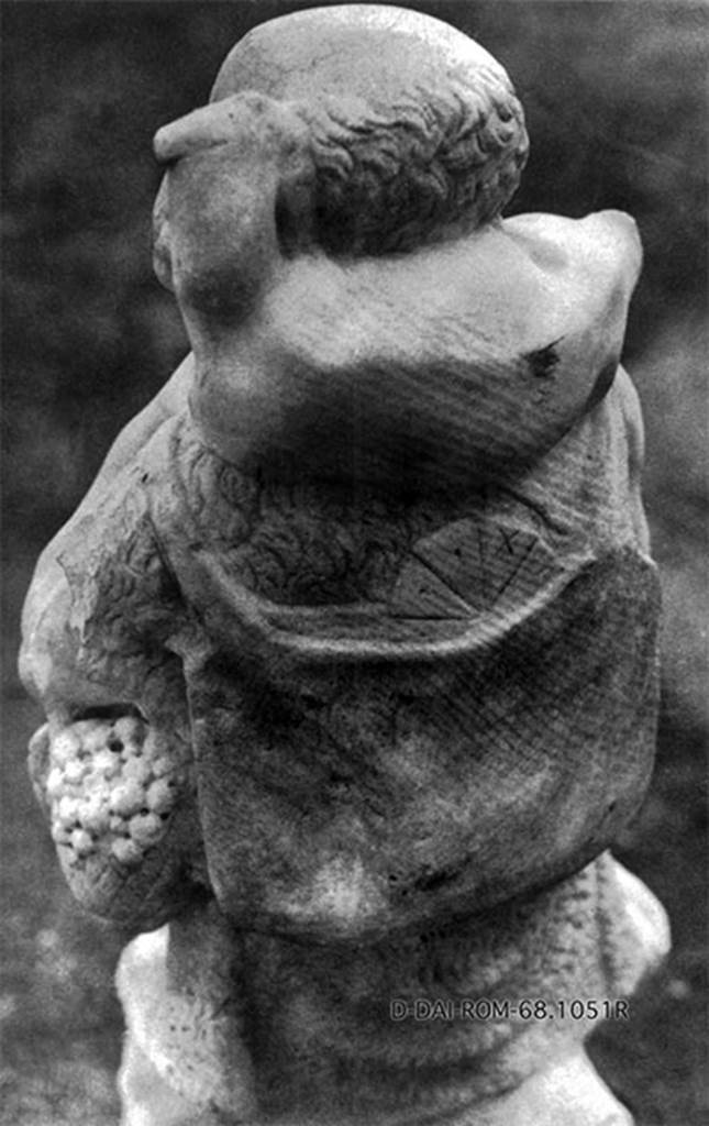 Castellamare di Stabia, Villa del Pastore. 1968? Rear of the statue of the shepherd. 
According to Kockel, He carries a backpack with a loaf of bread sticking out. 
See Kockel V., 1985. Funde und Forschungen in den Vesuvstädten 1: Archäologischer Anzeiger, Heft 3. 1985, p. 529ff, Abb. 11. 18. 23 Nr. 100.
DAIR 68.1051. Photo © Deutsches Archäologisches Institut, Abteilung Rom, Arkiv.
See http://arachne.uni-koeln.de/item/marbilder/4146661
