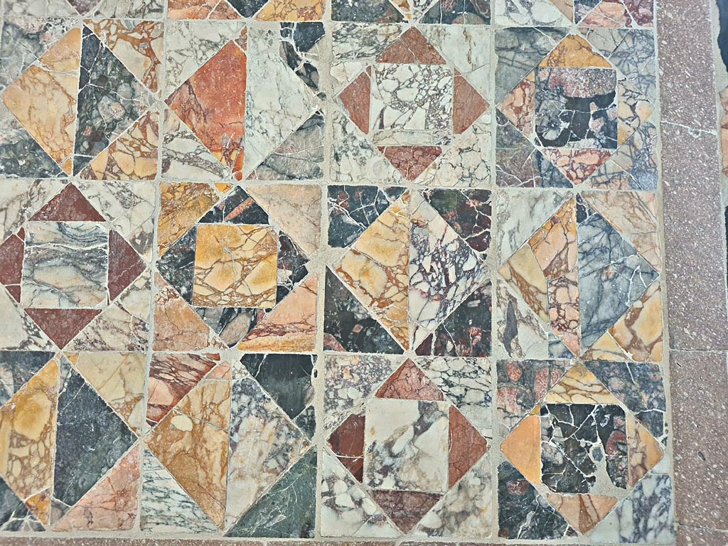 Opus Sectile floor on display in room CXLII on First floor in Naples Museum. June 2024. Photo courtesy of Giuseppe Ciaramella.
Detail from lower corner