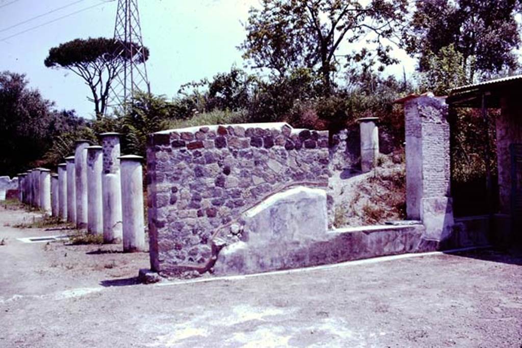 Stabiae, Secondo Complesso, 1976. Partially excavated peristyle garden. 
Looking east from triclinium 13 along north portico from doorway in east wall, with two windows overlooking peristyle. 
Photo by Stanley A. Jashemski.  
Source: The Wilhelmina and Stanley A. Jashemski archive in the University of Maryland Library, Special Collections (See collection page) and made available under the Creative Commons Attribution-Non-Commercial License v.4. See Licence and use details.
J76f0527