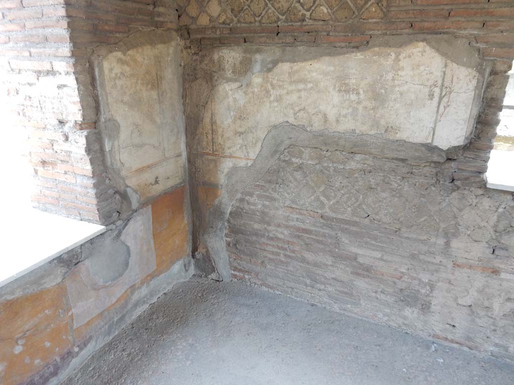 Stabiae, Villa Arianna, June 2019. Room E, detail of painted decoration in north-east corner.
Photo courtesy of Buzz Ferebee.