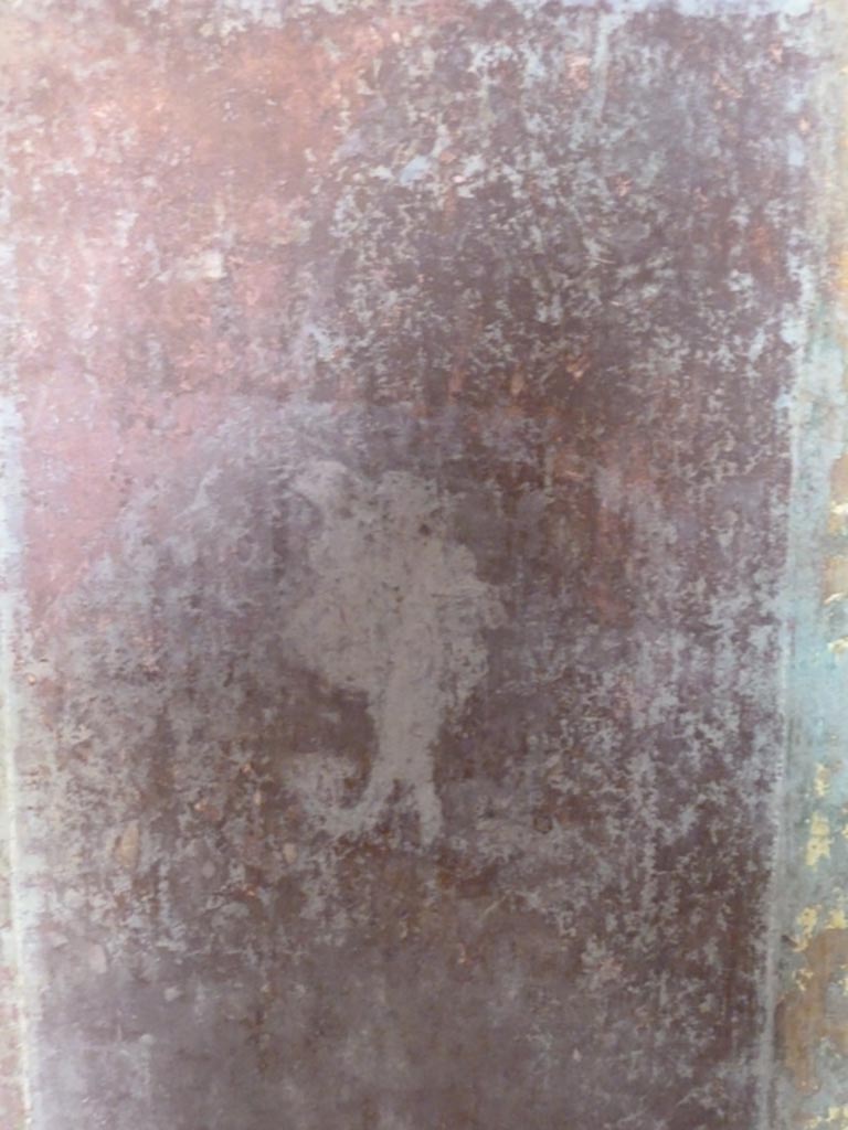 Stabiae, Villa Arianna, September 2015. 
Room 11, painted figure on red panel in middle of central panel on south wall.