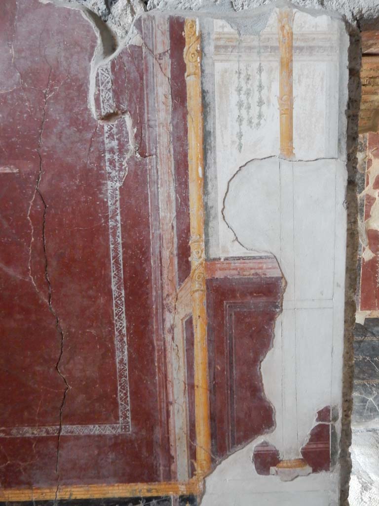 Stabiae, Villa Arianna, June 2019. 
Room 5, detail of panel at north end of west wall, with doorway to Corridor 8, on right.
Photo courtesy of Buzz Ferebee.