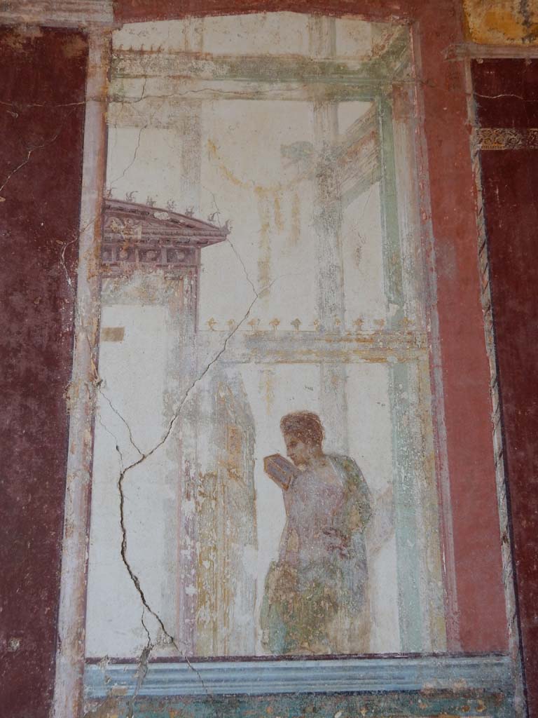 Stabiae, Villa Arianna, June 2019. Room 7, detail of painted figure on south end of east wall.
Photo courtesy of Buzz Ferebee.