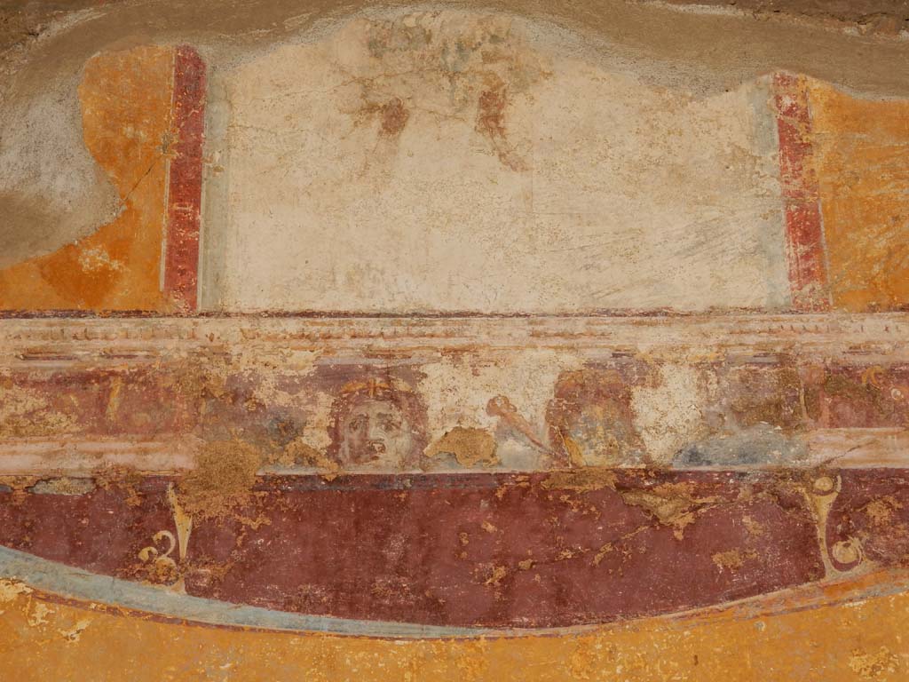 Stabiae, Villa Arianna, June 2019. Room 7, detail of painted decoration above central painting, from upper south wall
Photo courtesy of Buzz Ferebee.