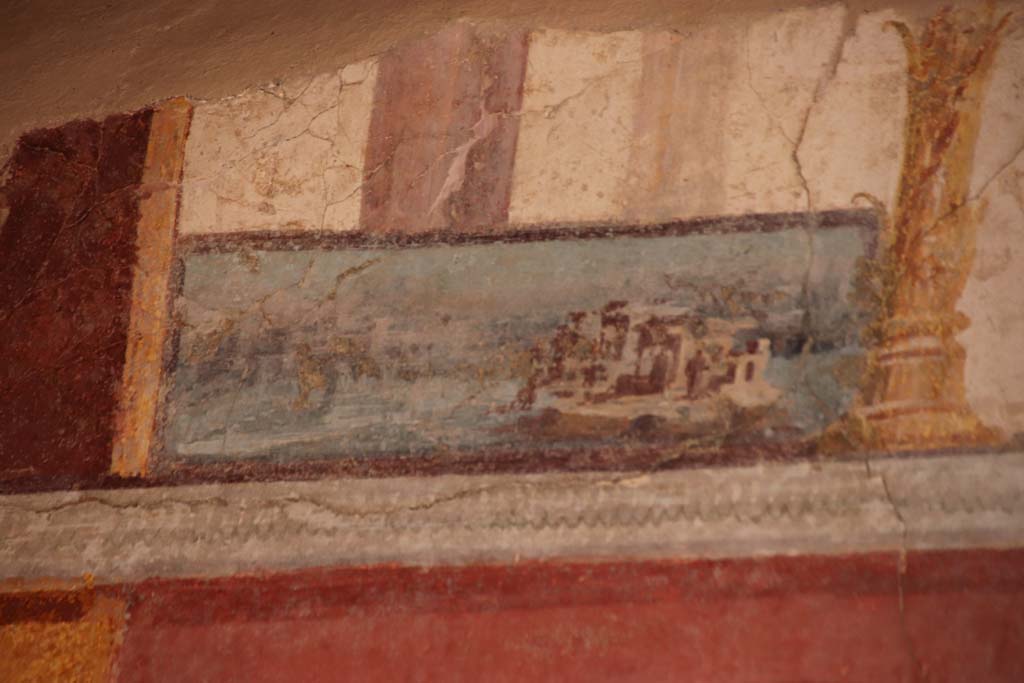 Stabiae, Villa Arianna, October 2020. 
Room 7, detail of painted panel on upper wall at south end of west wall. Photo courtesy of Klaus Heese.