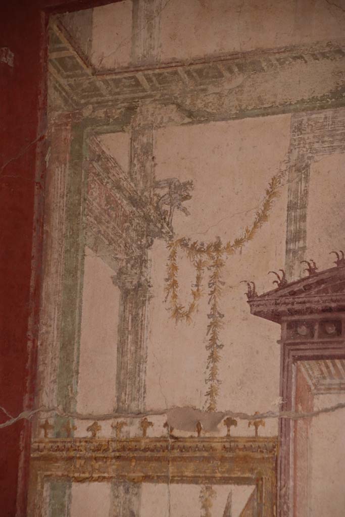 Stabiae, Villa Arianna, October 2020. 
Room 7, detail on upper painted panel above figure, at south end of west wall. Photo courtesy of Klaus Heese.