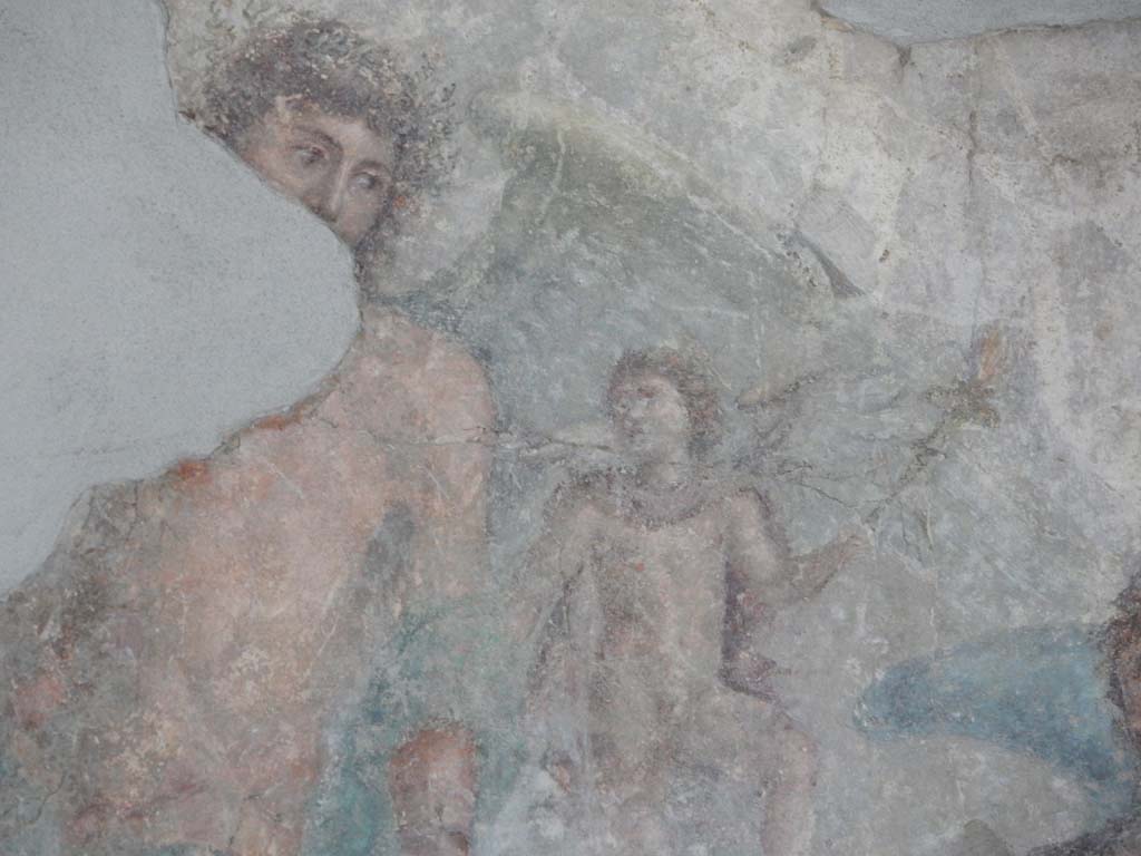 Stabiae, Villa Arianna, June 2019. Room 3, detail from painting on south wall, showing the face of Dionysus. 
Photo courtesy of Buzz Ferebee.