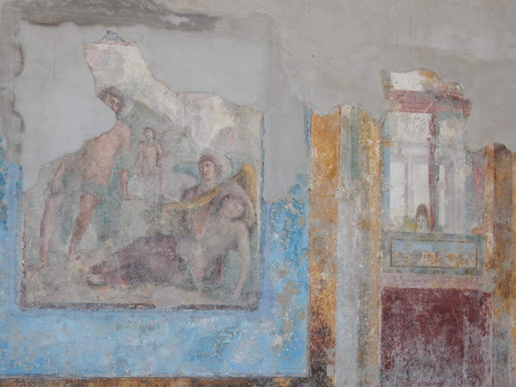 Stabiae, Villa Arianna, June 2019. Room 3, central painting and panel from west end of south wall.
Photo courtesy of Buzz Ferebee.