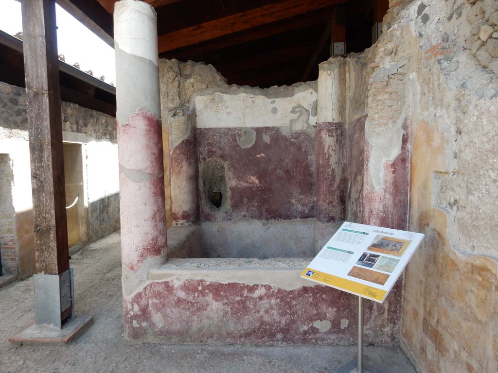 Stabiae, Villa Arianna, June 2019. Room 21, looking south to square pool. Photo courtesy of Buzz Ferebee.
In the west wall, on the right, traces can be seen from where the graffito found on 22nd September 1965 was cut from. 
According to Napolitano, in D'ORSI's excavation diary, Gli scavi di Stabiae, p. 364, we read –
“on 21 September 1965, Tuesday, during excavation works in the kitchen and bath area, on the western wall of a probable atrium, 0.70 m from the crest of the wall, 1.82 m more to the south of the left pillar of the entrance to the kitchen, 1.10 m wide, and 0.50 m further north of the first column of the western side of the impluvium with a high masonry pluteus, a graffito was brought to light, in Greek, consisting of a total of four lines 0.21 m long”.
See Napolitano, M. C. and Puglia, E., 2014. Novità su due graffiti greci da Stabiae. Papyrologica Lupiensia, N. 23, p. 59ff, note 22, fig. 6.