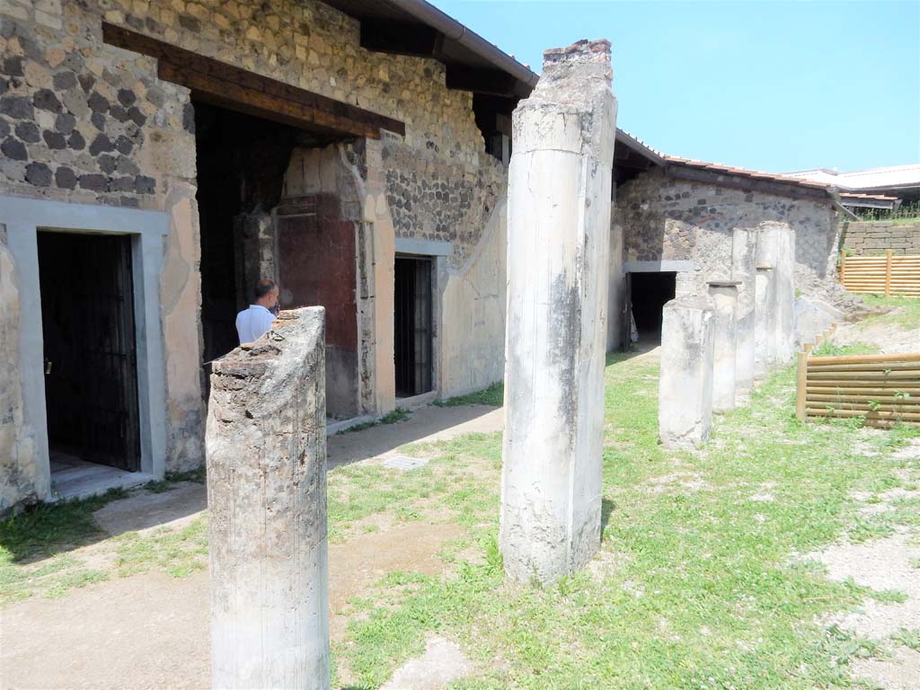 Stabiae, Villa Arianna, June 2019. W.22, north courtyard, looking towards large atrium doorway with painted decoration.
Photo courtesy of Buzz Ferebee.