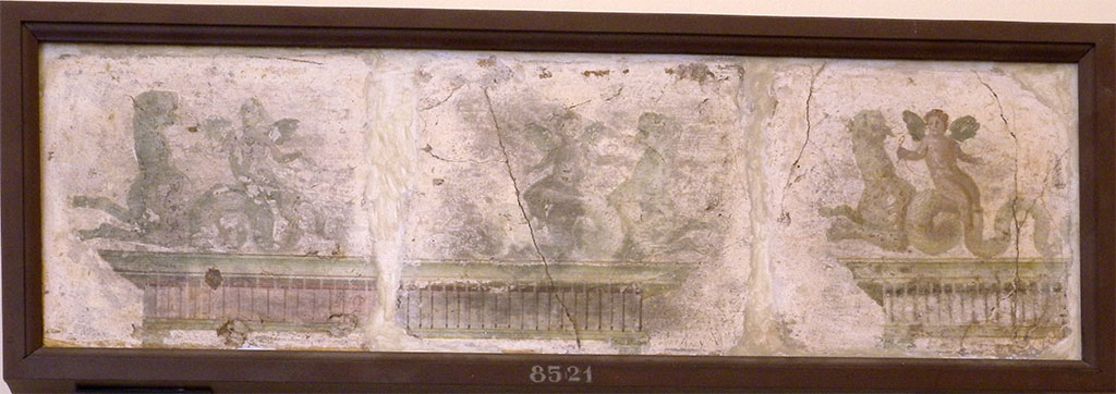 Stabiae, Villa Arianna, found 16th July 1759. Room W.24. 
These three fragments were assembled in a single frame after detachment from the walls of the room in which they were found in July 1759
Each fragment of wall painting has a cupid riding a sea panther.
The second is symmetrical to the first and is probably part of the same aedicula.
The third is the same group and pose as the first, but the cupid has natural colours.
Now in Naples Archaeological Museum. Inventory number 8521.
See Sampaolo V. and Bragantini I., Eds, 2009. La Pittura Pompeiana. Electa: Verona, p. 487.
See Pagano, M. and Prisciandaro, R., 2006. Studio sulle provenienze degli oggetti rinvenuti negli scavi borbonici del regno di Napoli. Naples: Nicola Longobardi, p. 243.