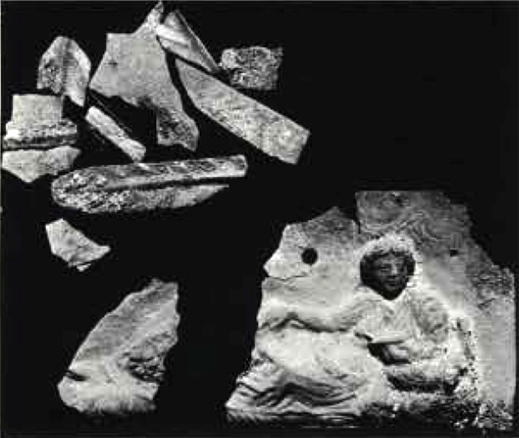Boscoreale, Villa rustica in via Casone Grotta, proprietà Risi di Prisco. Lararium. Silver sheet with reclining female figure, as found.
See Rivista di Studi Pompeiani I, 1987, fig.27, p. 165.