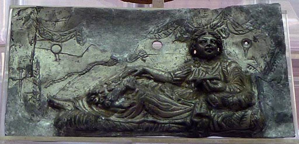 Boscoreale, Villa rustica in via Casone Grotta, proprietà Risi di Prisco. Lararium. Restored silver plaque with relief of a female figure relaxing.
Now in Boscoreale Antiquarium. Photo courtesy of Michael Binns.