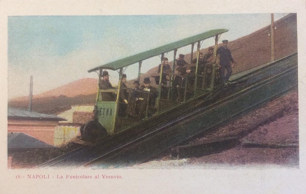 Postcard showing the Vesuvius Funicular car Etna. Not dated, but with interesting handwritten note on rear -
“The original 1880 Funicular had 2 cars ETNA and VESUVIO”.  Photo courtesy of Rick Bauer.
This is one of two new cars, also named Etna and Vesuvio, but seating 10 people, introduced in 1889 as part of renovations by John Mason Cook.