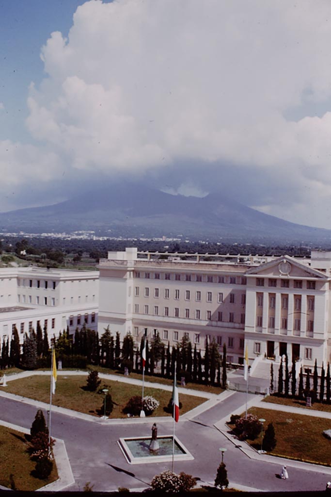 Looking north from hotel in modern Pompeii, towards a cloud covered Vesuvius. 1964.  
Photo by Stanley A. Jashemski.
Source: The Wilhelmina and Stanley A. Jashemski archive in the University of Maryland Library, Special Collections (See collection page) and made available under the Creative Commons Attribution-Non-commercial License v.4. See Licence and use details.
J64f1391