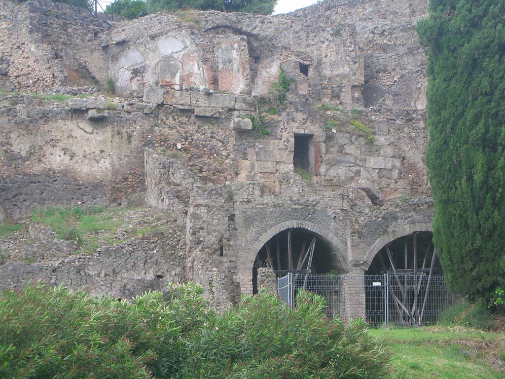 VIII.2.A, on left, and VIII.2.1, on right, Pompeii. May 2010. 
Looking north from rear of house towards ground level (at top) and three lower levels. Photo courtesy of Ivo van der Graaff.
