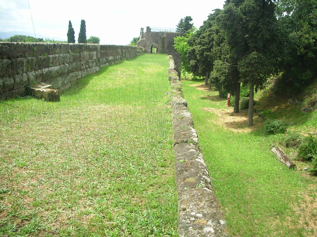 City Walls on north side of Pompeii. May 2010. 
Looking west from near Tower X along both sides of City Walls towards Tower XI. Photo courtesy of Ivo van der Graaff.