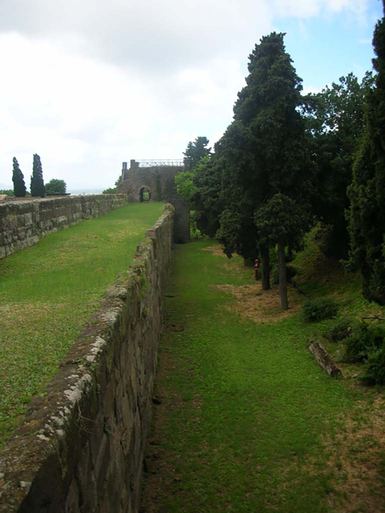 Tower XI, Pompeii. May 2010. 
Looking west along exterior City Wall, from Tower X. Photo courtesy of Ivo van der Graaff.
