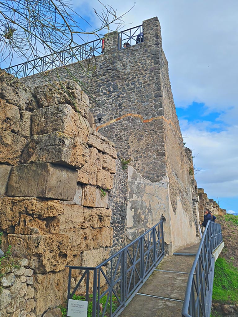Walls on west side of Tower XI, Pompeii. November 2023. 
Looking east towards entrance doorway to tower. Photo courtesy of Giuseppe Ciaramella.
