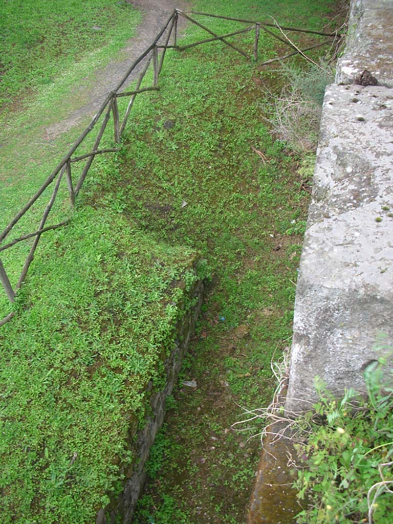 Walls on north side of Pompeii. May 2010. 
Looking down from top of wall. Photo courtesy of Ivo van der Graaff.