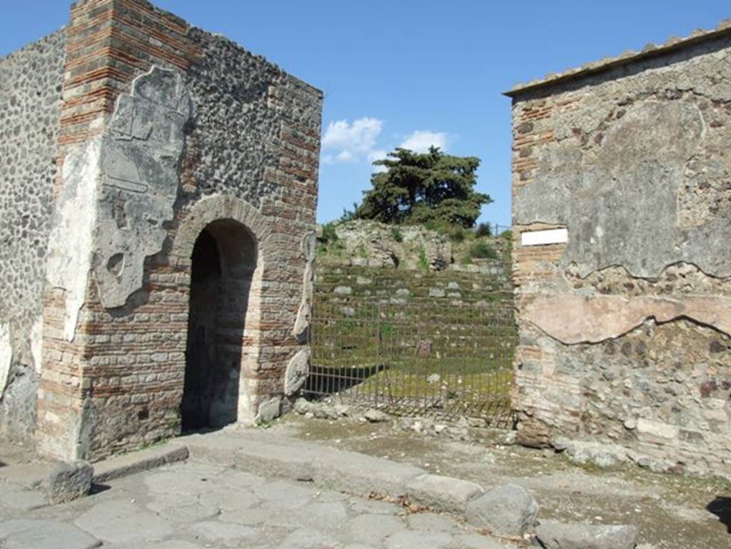 Pompeii city walls at Herculaneum gate. March 2009. The walls can be seen through the entrance of VI.1.1.
See Notizie degli Scavi, 1943, (p.275-294), 
for article entitled “Isolation of the wall between the Vesuvius Gate and Herculaneum Gate.”
(Isolamento della cinta murale fra Porta Vesuvio e Porta Ercolano).