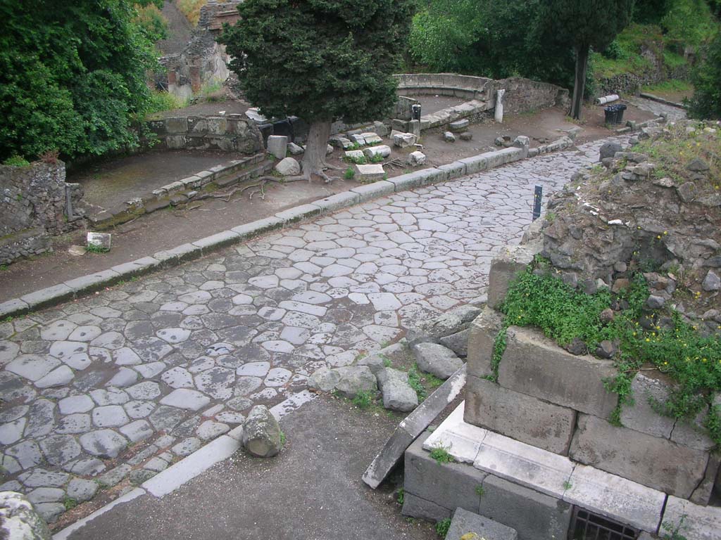 City Wall in north-west corner, Pompeii. May 2010. 
View from top of wall, looking down onto Via dei Sepolcri. Photo courtesy of Ivo van der Graaff.