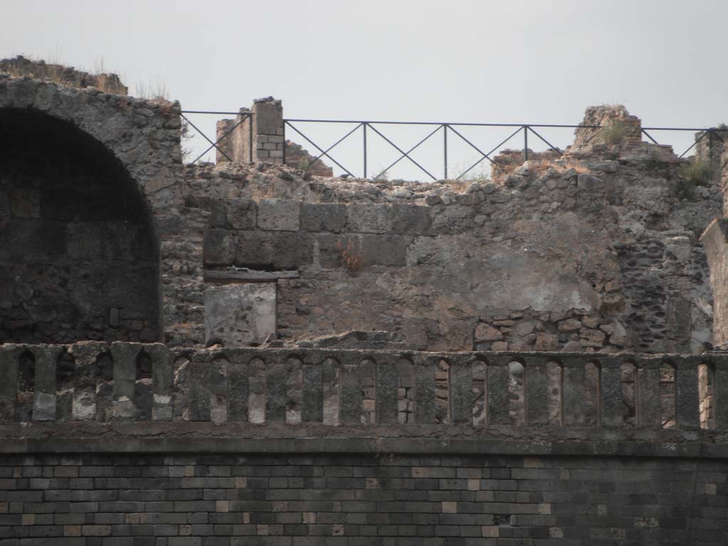 VIII.2.34 Pompeii. May 2011. 
Room ‘8’, looking north across middle triclinium on lower level towards detail of north wall. Photo courtesy of Ivo van der Graaff.