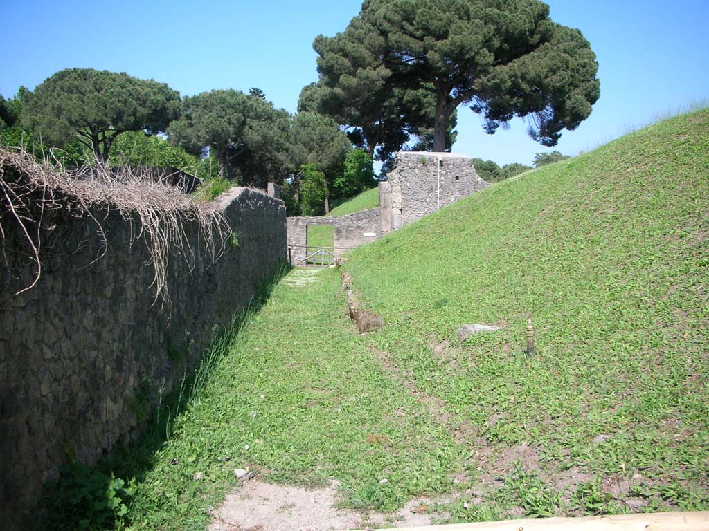Porta Nocera, Pompeii. May 2010. Looking east, with southern wall of I.20.1 on left.
Looking east towards north end of west side of Gate, and across Via Nocera to gateway to the eastern side. Photo courtesy of Ivo van der Graaff.
