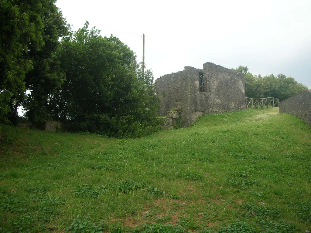 Tower VI, Pompeii. May 2010. 
Looking towards west side of Tower, with remaining City Walls on its left. Photo courtesy of Ivo van der Graaff.