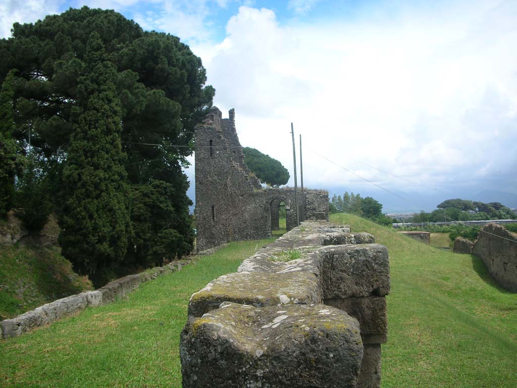 City Walls on north side of Pompeii. May 2010. 
Looking east from near Tower XI along both sides of City Walls towards Tower X. Photo courtesy of Ivo van der Graaff.